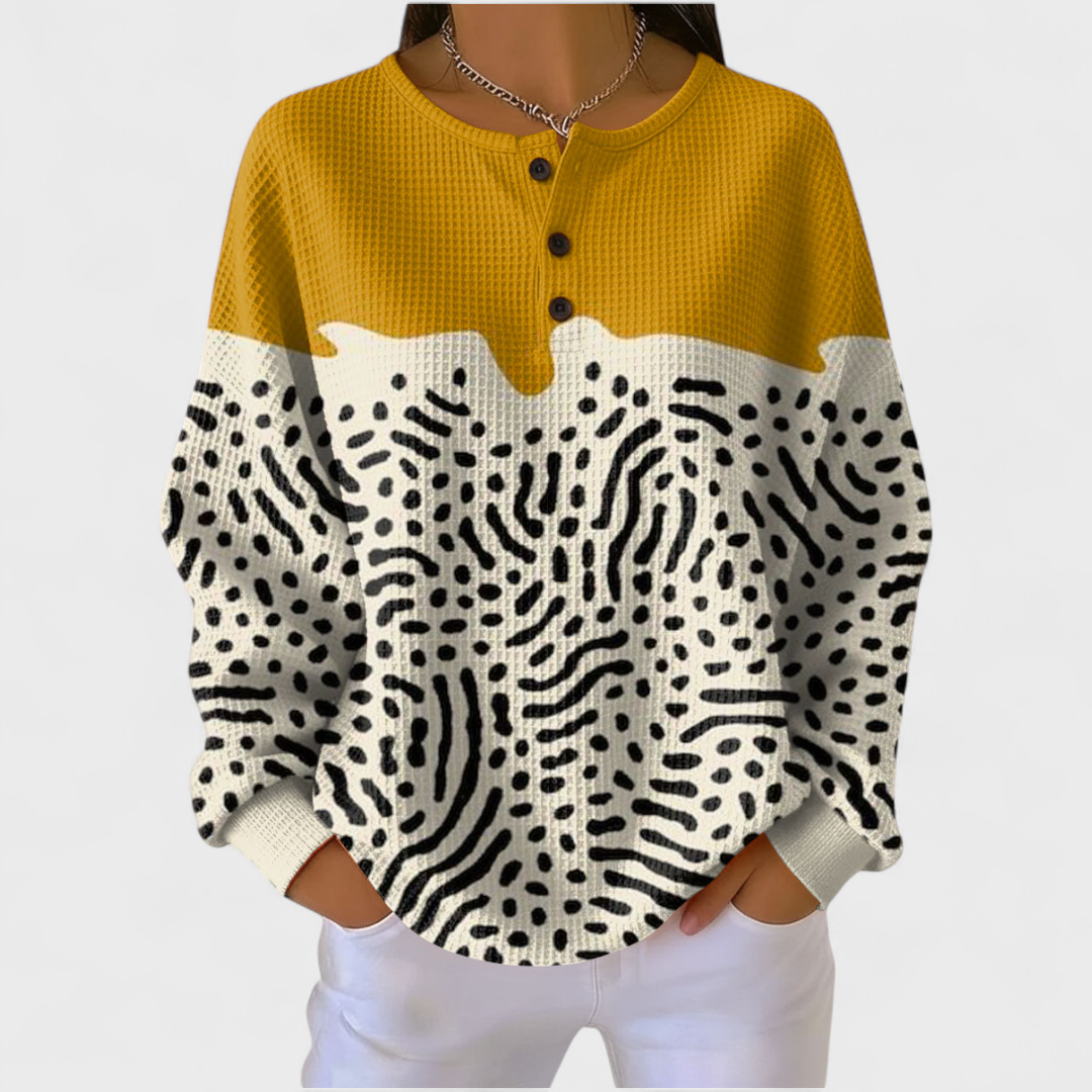Liv - Suéter amarillo y blanco con estampado animal
